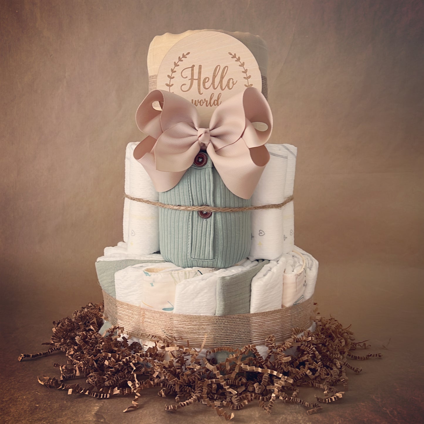 Elegant Baby Shower Diaper Cake Bundle: Cream Muslin Blanket, Organic Romper, and Adorable Accessories!